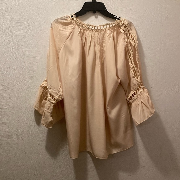 Women’s cream colored top with lace accents and lace cut out on arms. - Picture 1 of 5